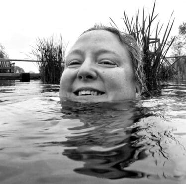 A woman smiles at the camera while smiling